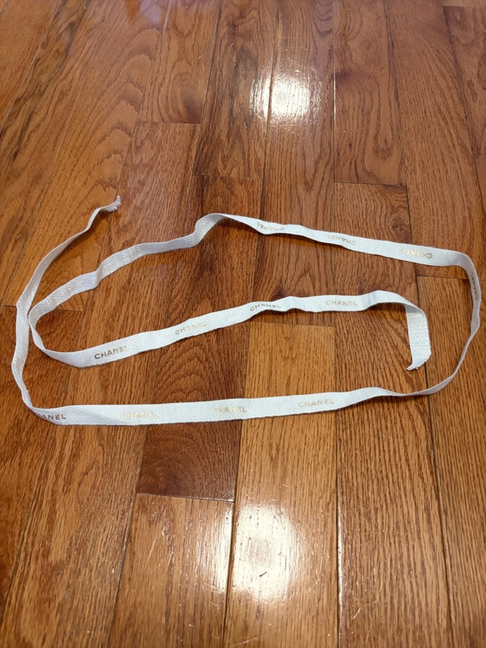 CHANEL White and Gold Logo Ribbon